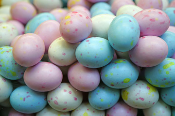 Small colorful chocolate eggs in hard sugar shell in bulk for Easter