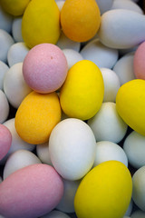 Small colorful chocolate eggs in hard sugar shell in bulk for Easter