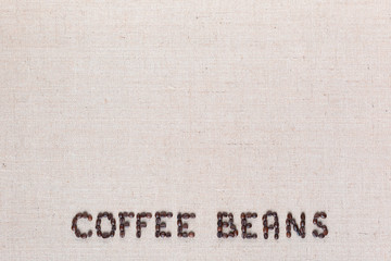 Coffee beans inscription from seeds arranged bottom center