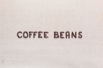 Coffee beans inscription from seeds arranged in center