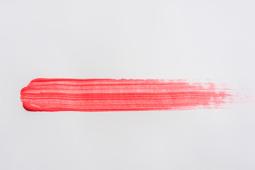 Trace of red paint, painted with a brush, close up