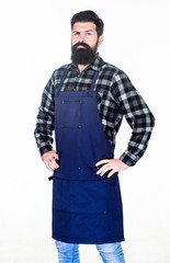 Serving at a hairdressers. Barber isolated on white. Bearded man wearing barber apron. Hipster in work apron with multiple pockets. Hair stylist in barber shop. Barbershop or hairdressing salon