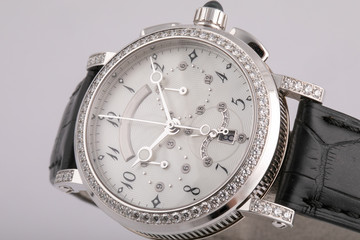 Female silver watch with a white dial, silver clockwise, chronograph, stopwatch, framing of the...