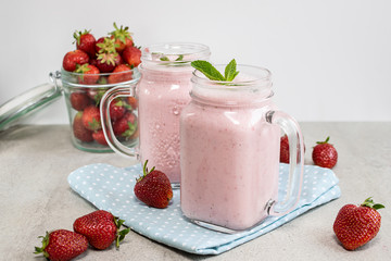 Fresh organic sugar free strawberry smoothie or milkshake on the table. Healthy dessert concept.
