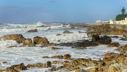 Waves hitting the shore at a beach in Porto