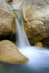 small waterfall on mountain river