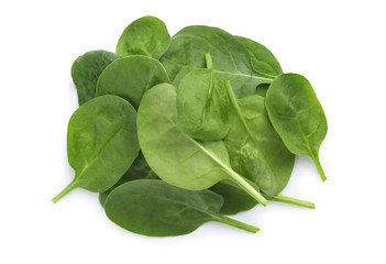 Pile of fresh spinach leaves isolated on white, top view