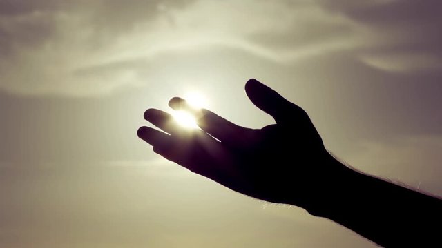 Grasping touching The Sun With Palm/fingers Slow Motion