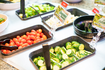 Various vegetable and fruit salad in salad bar shop