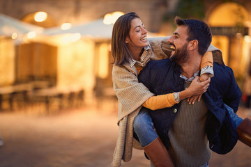 Young man and woman in love flirting while enjoying on Italy .