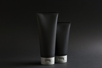 Set of men's cosmetic on black background. Mockup for design