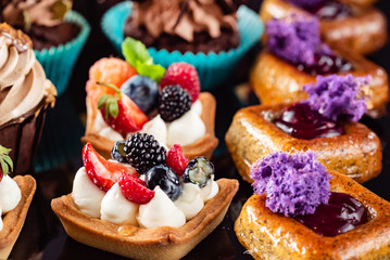french pastries on the black background