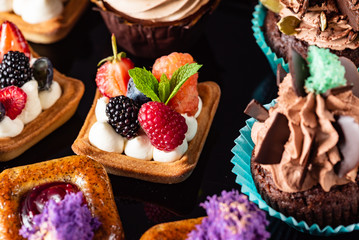 french pastries on the black background