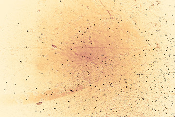 Vintage yellow background. Rough painted wall of aspen gold color. Imperfect plane of golden colored. Uneven old decorative toned backdrop of yellow tint. Texture of gold hue. Ornamental stony surface