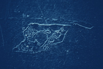 Vintage blue background. Rough painted wall of sapphire color. Imperfect plane of blue colored. Uneven old decorative toned backdrop of cyan tint. Texture of sapphirine hue. Ornamental stony surface.