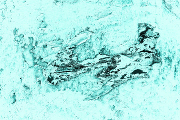 Vintage azure background. Rough painted wall of turquoise color. Imperfect plane of cyan colored. Uneven old decorative toned backdrop of aqzure tint. Texture of teal hue. Ornamental stony surface.