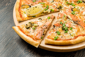 slice of pizza on the wooden tray