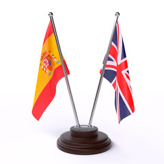 Spain and UK, two table flags isolated on white background. 3d image