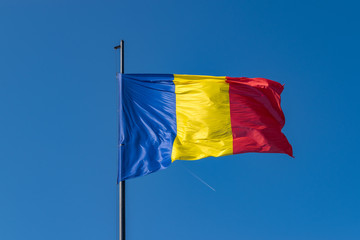 Romanian flag waving on a sunny summer day in Alba Iulia, Romania