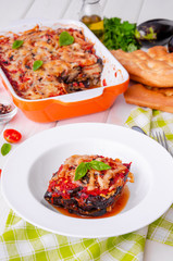 Eggplant casserole with tomato sauce, cheese and fresh basil. Delicious summer stew.