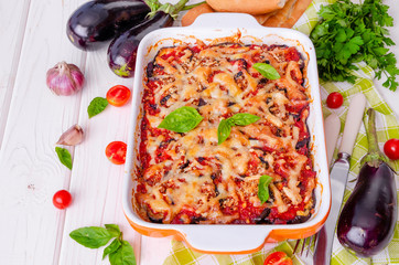 Eggplant casserole with tomato sauce, cheese and fresh basil. Delicious summer stew.