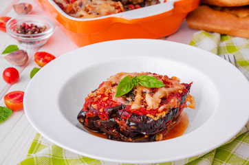 Eggplant casserole with tomato sauce, cheese and fresh basil. Delicious summer stew.
