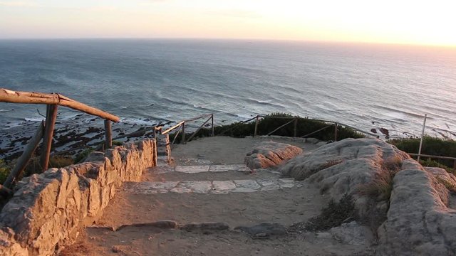 Gentle Ocean waves seen from a rustic viewpoint in Cabo Mondego, in Portugal.