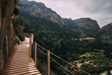 Fototapeta na wymiar Wooden walkway among rock mountains in south of Spain