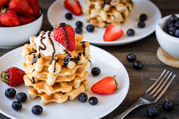 Waffles with berries and whipped cream
