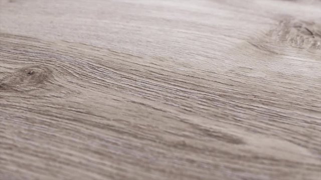 Macro shot of wood parquet, ground. Detailed close up  brown wooden carpenter interior decor pan movement.  