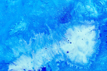 Fototapeta na wymiar Abstract art texture background. Sea wave foam design. Beautiful blue and white paints with bubbles and sparkling effect.