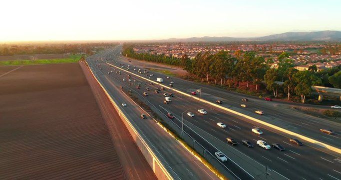 Aerial view from above freeway showing commuters in cars during traffic driving home