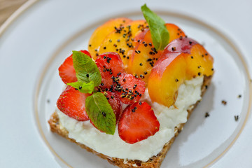 Smorobrod with strawberry peach and cheese dessert