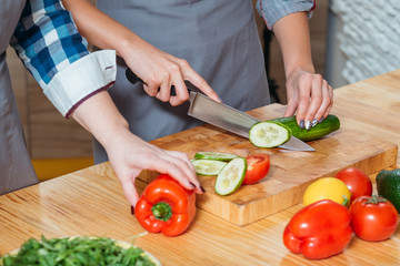Women making salad. Healthy balanced nutrition eating habit vegan lifestyle. Females on diet preparing organic vegetables.