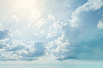 Blue sky clouds background. Beautiful landscape with clouds and sun