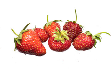 Ripe strawberries on a light background with splashing water close up