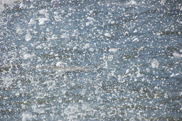 A close-up pattern of a splashing wave