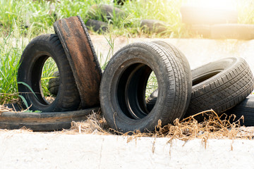 Pile of used tires and leave them on the grass.