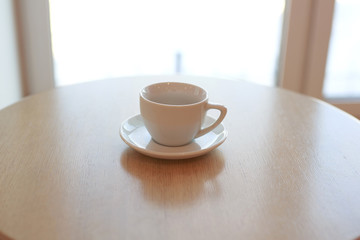 wooden table white Cup and saucer side view