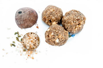 Winter dessert isolated on white i.e. Moti chur ke lado in a glass plate along with gund katira.