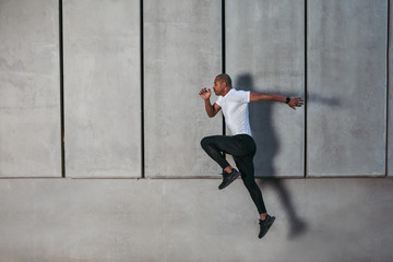 Athletic young man running
