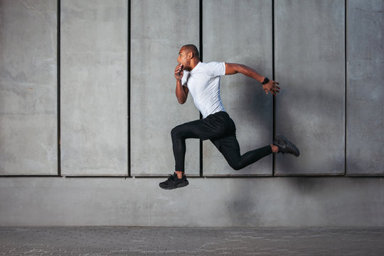 Athletic young man running