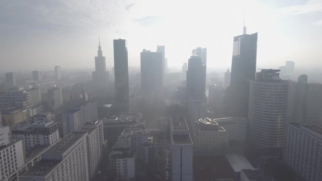 Warsaw / Poland. Aerial view of modern skyscrapers in the business center at sunrise. Cityscape with downtown buildings. 4K