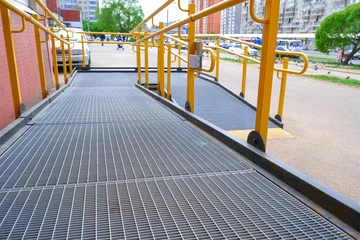 Fotobehang A button to call for help. A ramp for the disabled. The specific path of the ramp with stainless steel handrail. Sign for disabled. © Андрей Михайлов