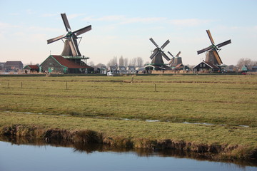 panorama of windmills on Dutch rivers and canals in Zaanse schans