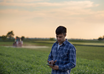 Farmer with tablet in field