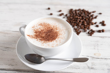 cappuccino on rustic white wood board