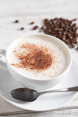 cappuccino on rustic white wood board