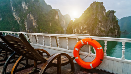 Ring life buoy Discover Halong Bay Top Destinations Vietnam. Cruise wooden junk sailing rocky islands the emerald waters of Ha Long Bay.