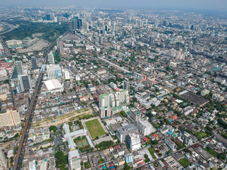 Fototapeta na wymiar Bangkok midtown city building with BTS sky train aerial view